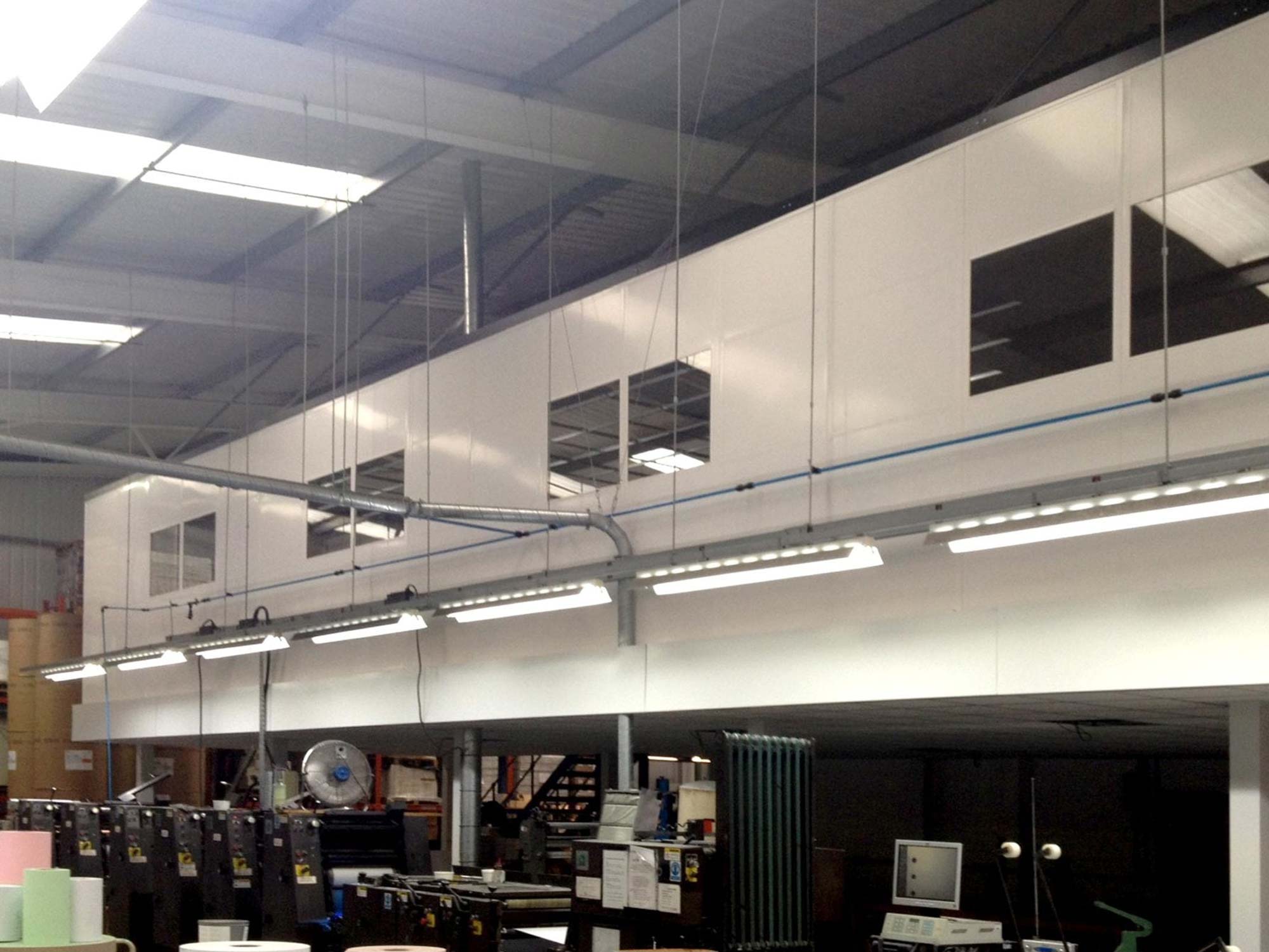 Interior of an industrial facility with machineries Interior of an industrial facility with machineries