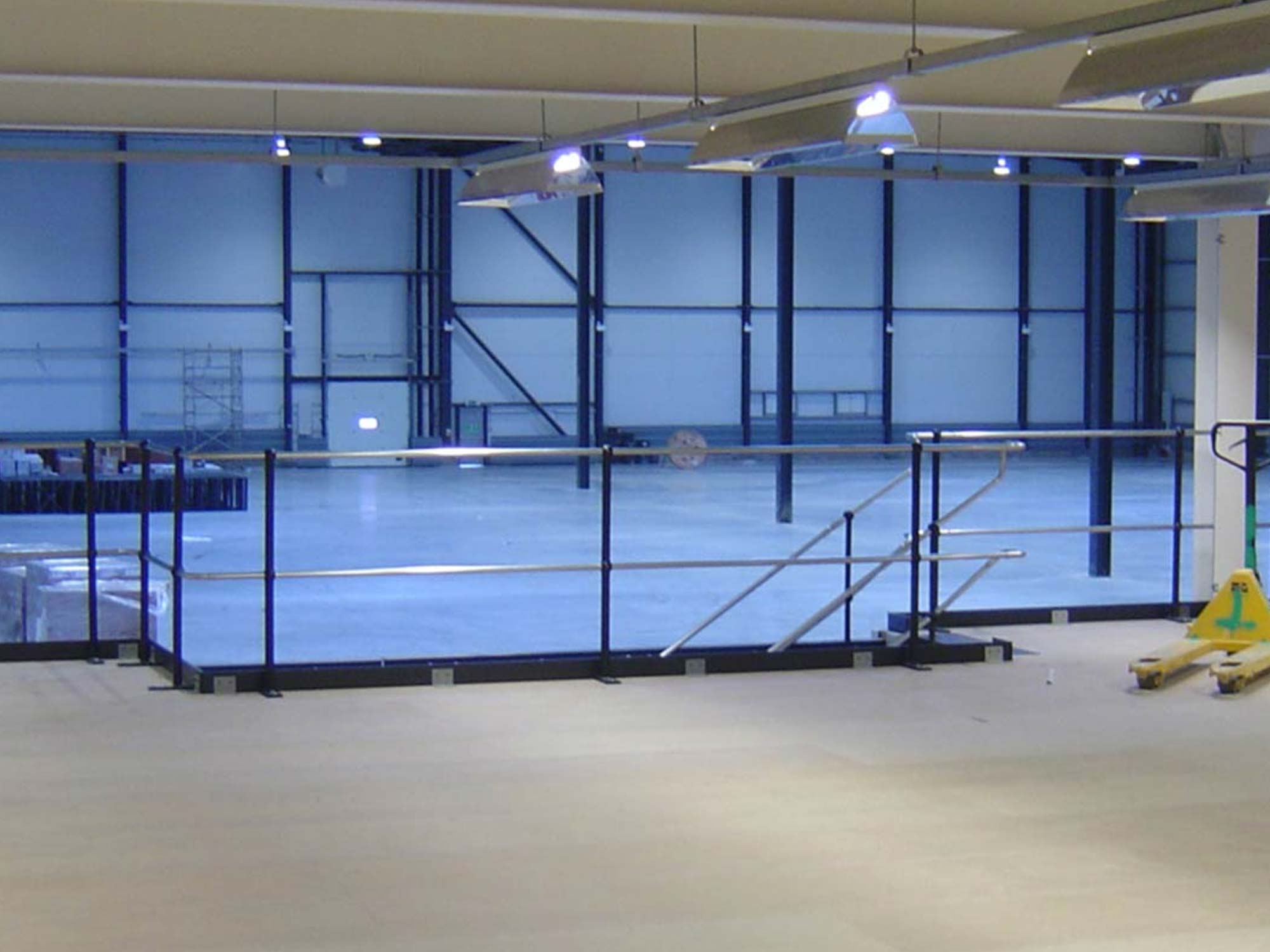 close up of mezzanine floor with safety railing close up of mezzanine floor with safety railing