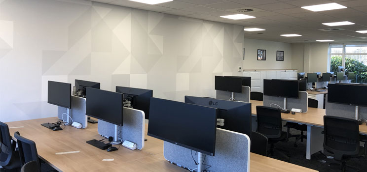 computers and speakers upon desk in office