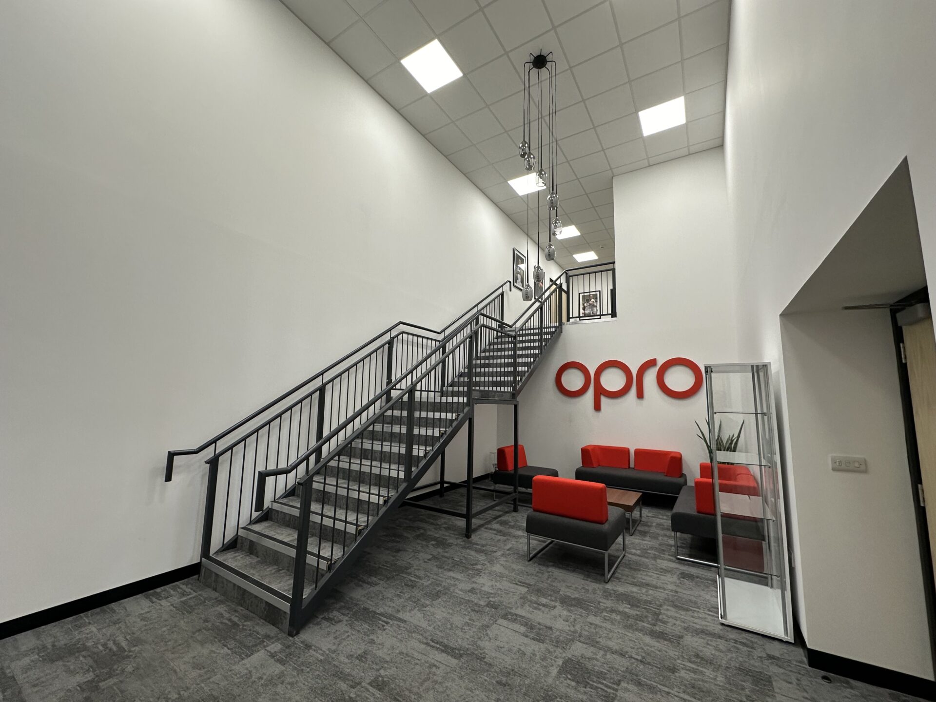 company logo with stairs leading to second floor company logo with stairs leading to second floor