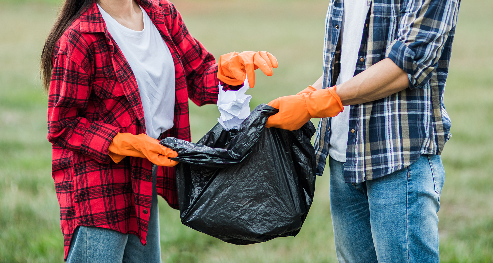 Men and women help each other to recycle